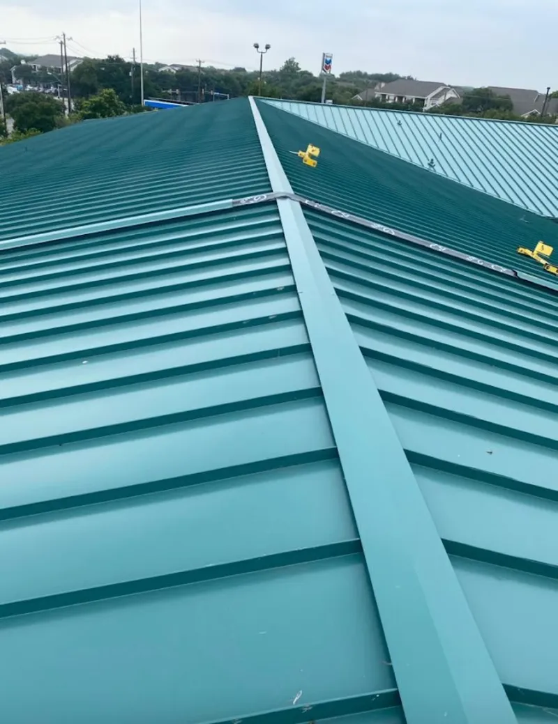 Green commercial metal roof ridge and valley for Metal Roof Repair in Caledonia